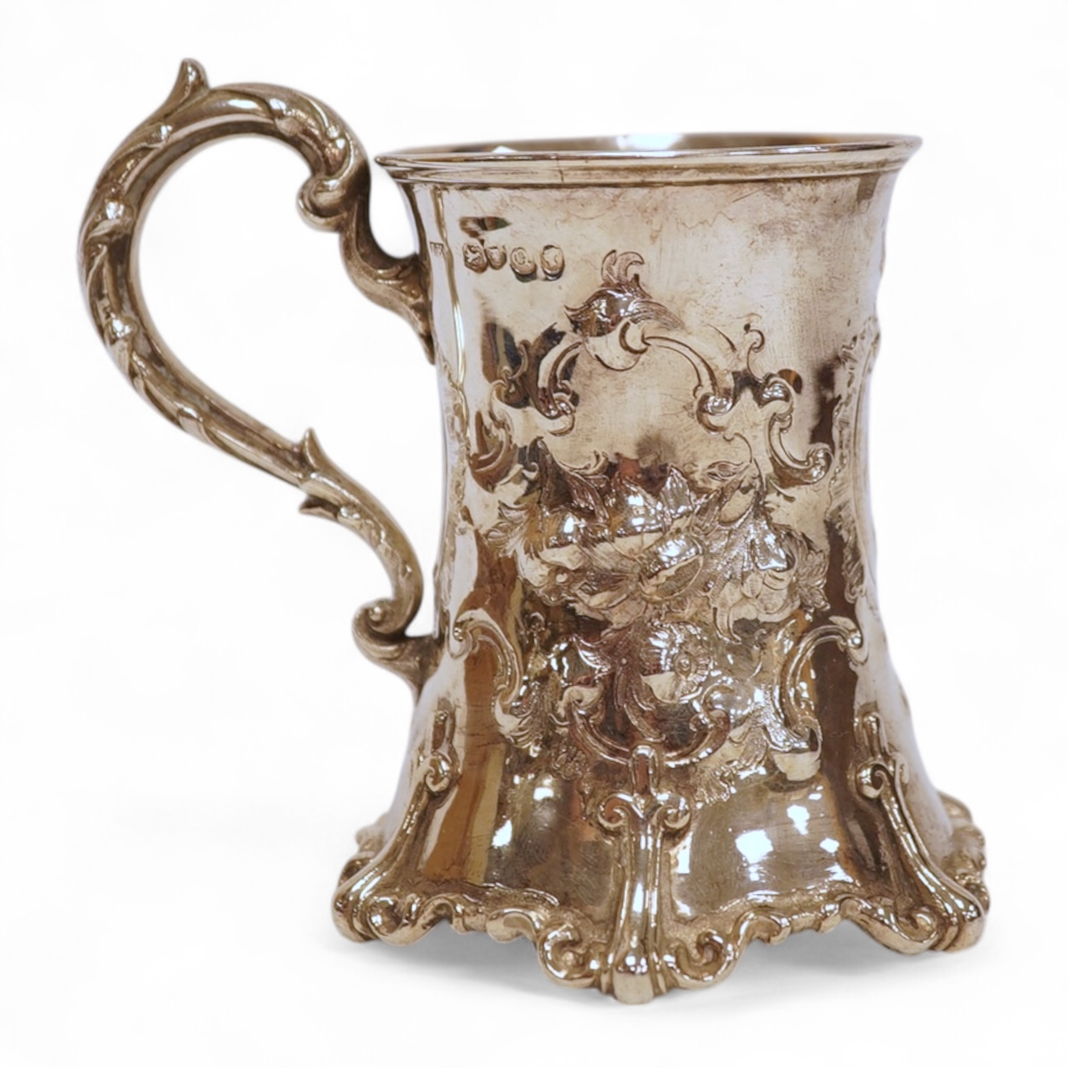 A Victorian embossed silver christening mug, of waisted form, by John Keith, London, 1851, height 10.2cm, 5.8oz.